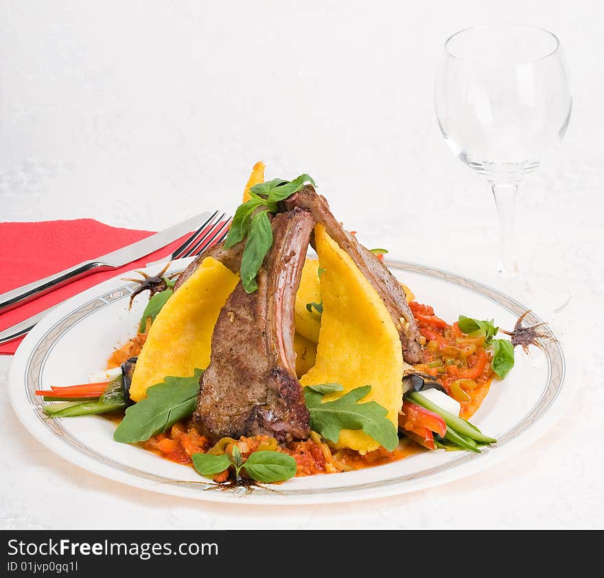 Roasted meat and vegetables over light background