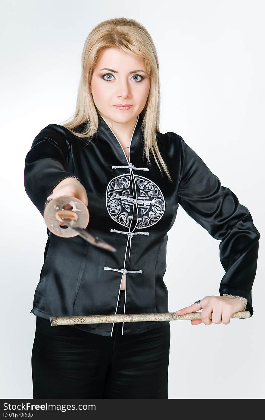 Woman In Japanese Shirt Holding Sword