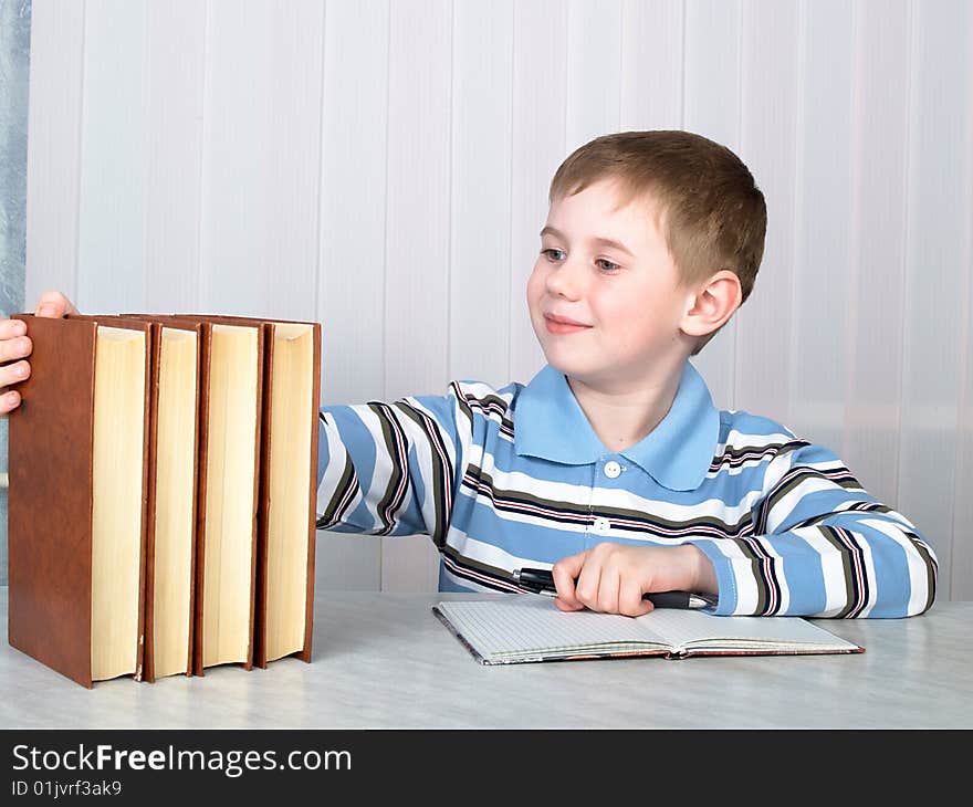 The child with books on the table