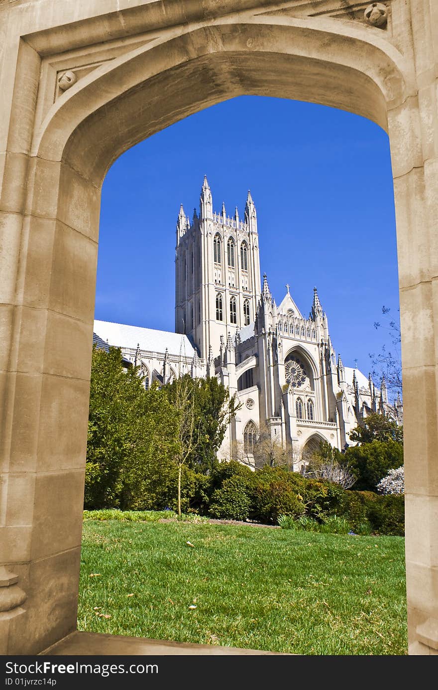 National cathedral in Washington DC through an arch on a stone wall. National cathedral in Washington DC through an arch on a stone wall.