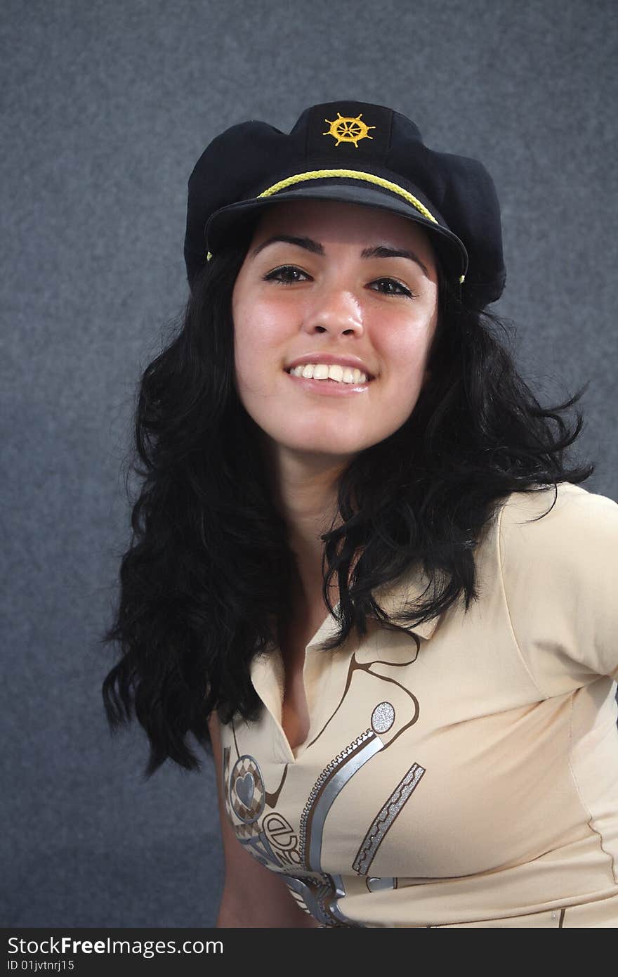 Lovely girl smiling with dark blue nautical cap. Lovely girl smiling with dark blue nautical cap