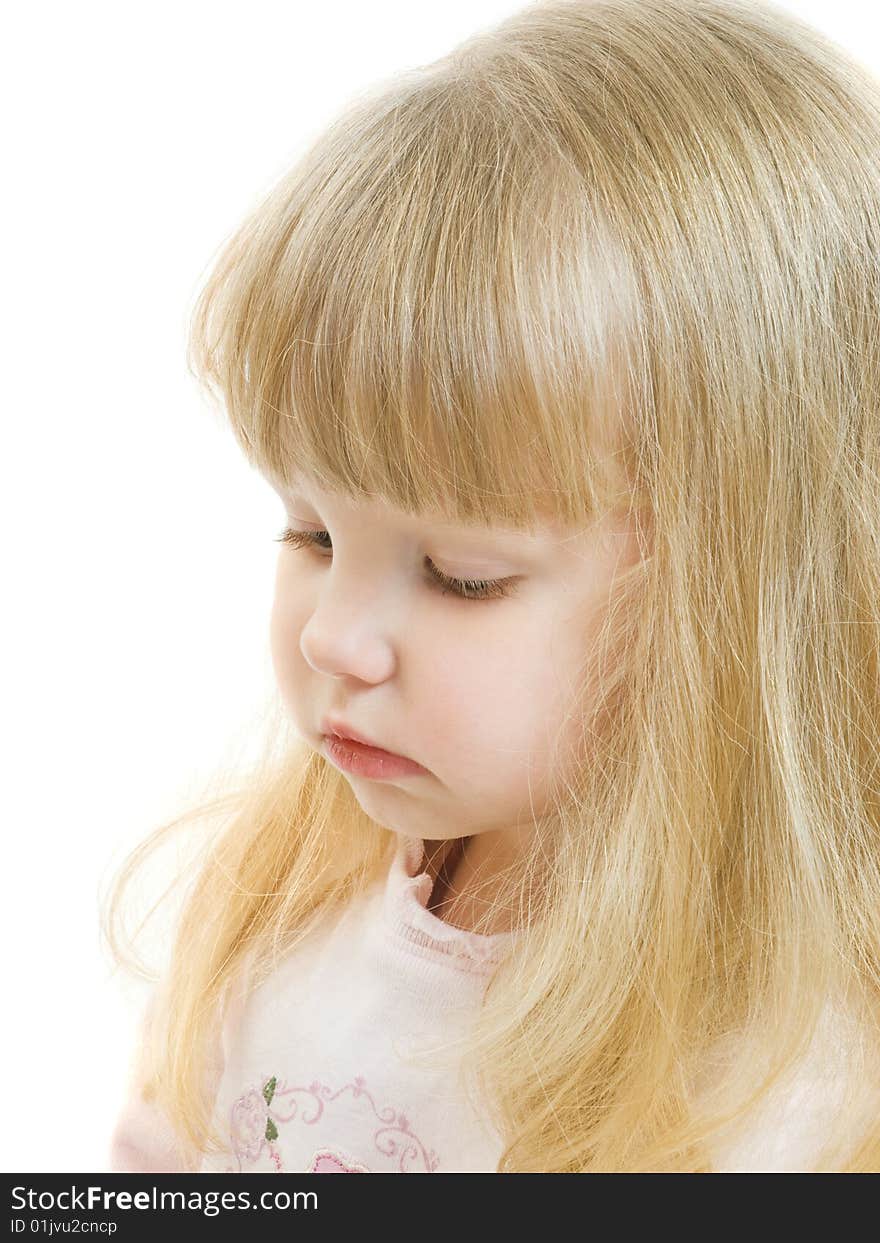 Portrait of blue eyed blonde toddler looking down. Portrait of blue eyed blonde toddler looking down