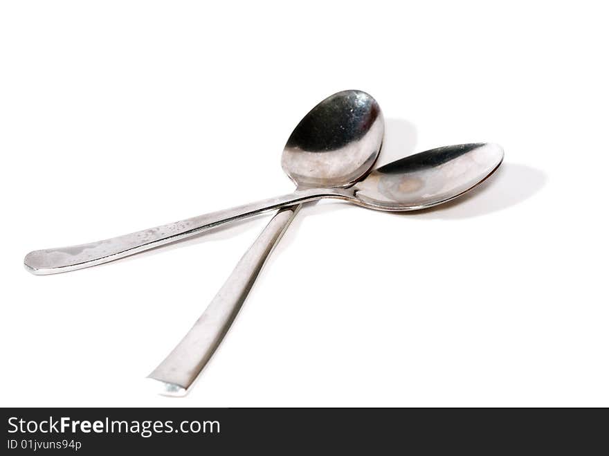 Close up metal spoon on white background. Close up metal spoon on white background