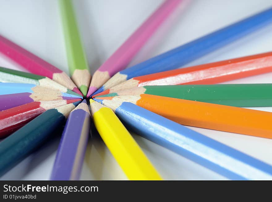 Closeup of colored pencils on white background