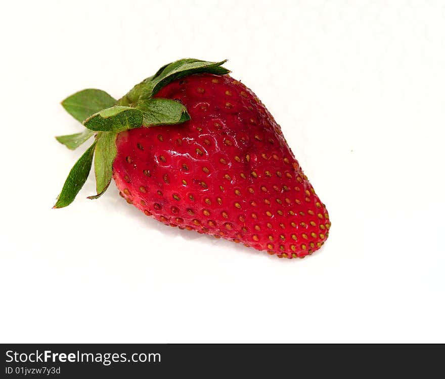 Strawberries with sheet green on white background