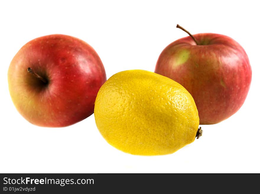 Lemon and apples isolated on white background