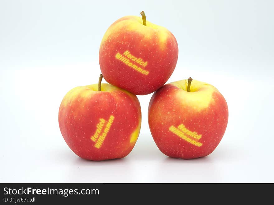 Three Welcome-Apples are showing a nice and friendly welcome!. Three Welcome-Apples are showing a nice and friendly welcome!