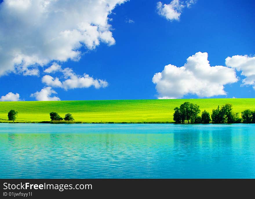 White clouds and a green field. White clouds and a green field