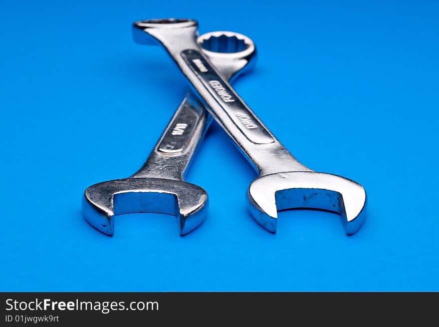 A pair of old worn combination wrenches