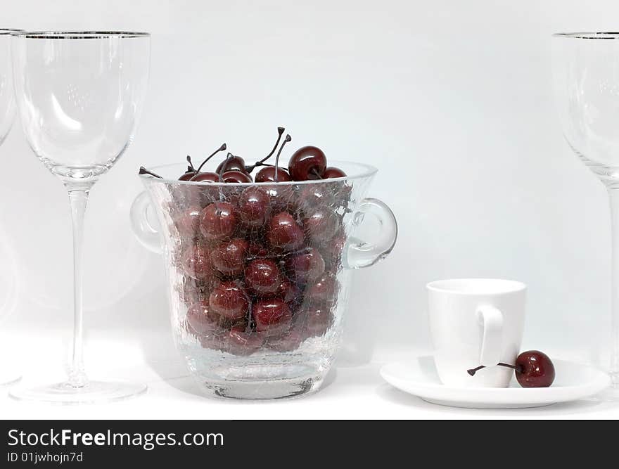 Icebucket with plastic cherry on the table