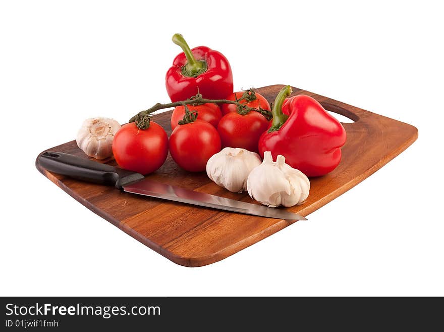 Vegetables and knife on cutting board