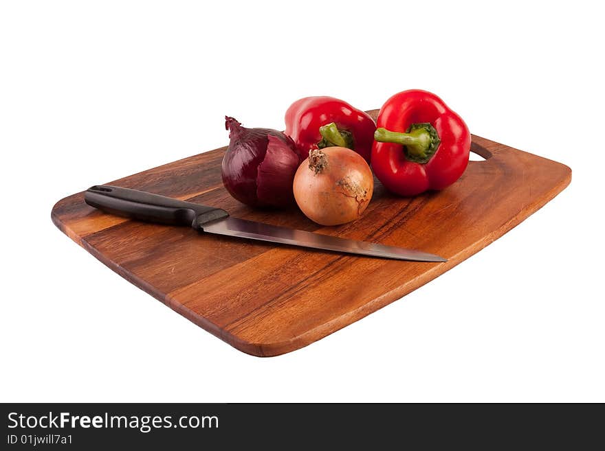 Vegetables and knife on cutting board