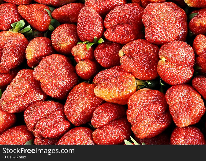 Heap of ripe sweet strawberry. Theme of summer. Heap of ripe sweet strawberry. Theme of summer.