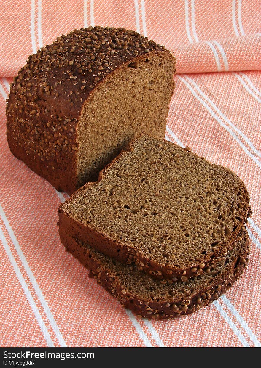 Spicy black bread slices with coriander seeds