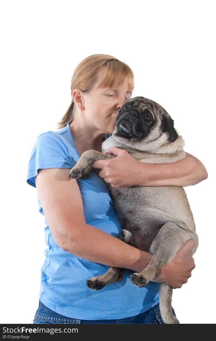 Mature Lady Cuddling a Pug Dog, Isolated on a White Background. Mature Lady Cuddling a Pug Dog, Isolated on a White Background