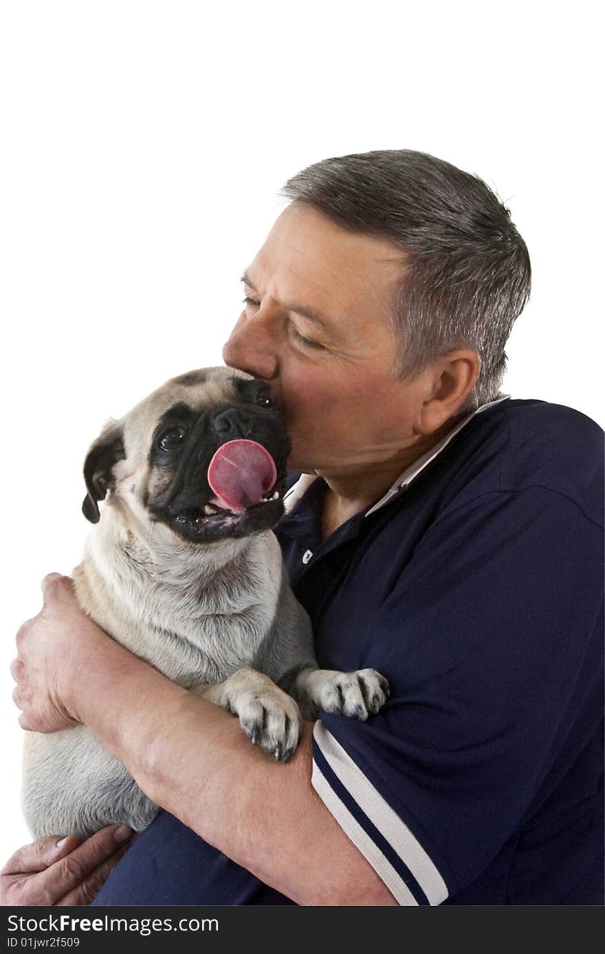 Mature man holding a Pug dogs with it's tongue stuck out, isolated on a white background. Mature man holding a Pug dogs with it's tongue stuck out, isolated on a white background