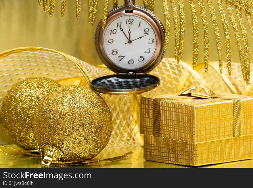 Christmas balls and gift box with clock