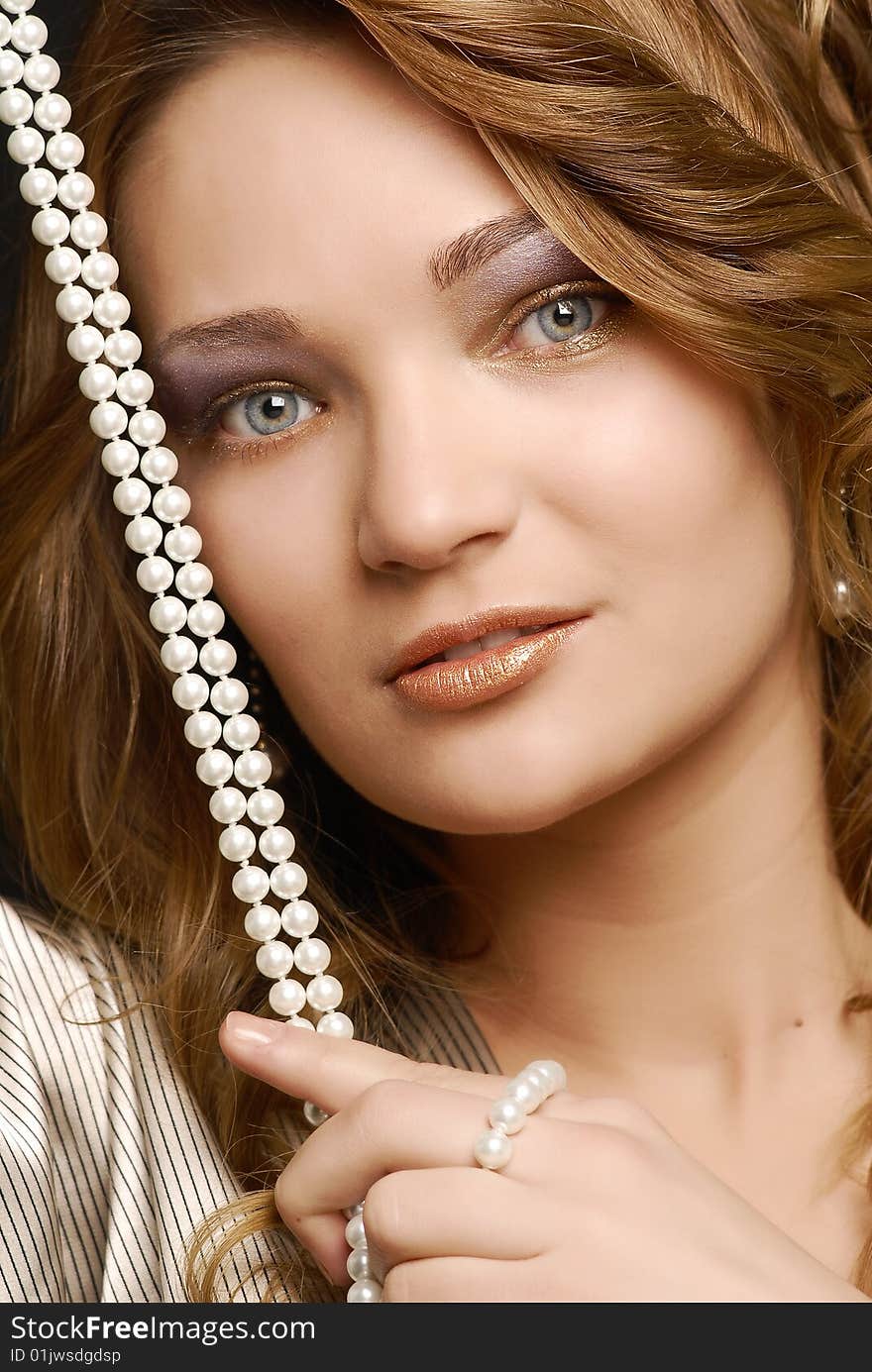 Fashion girl portrait with pearls