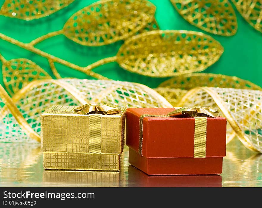 Golden and red gift boxes with leaves