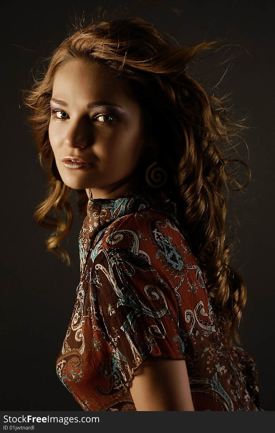 Fashion girl portrait with wind in her hair