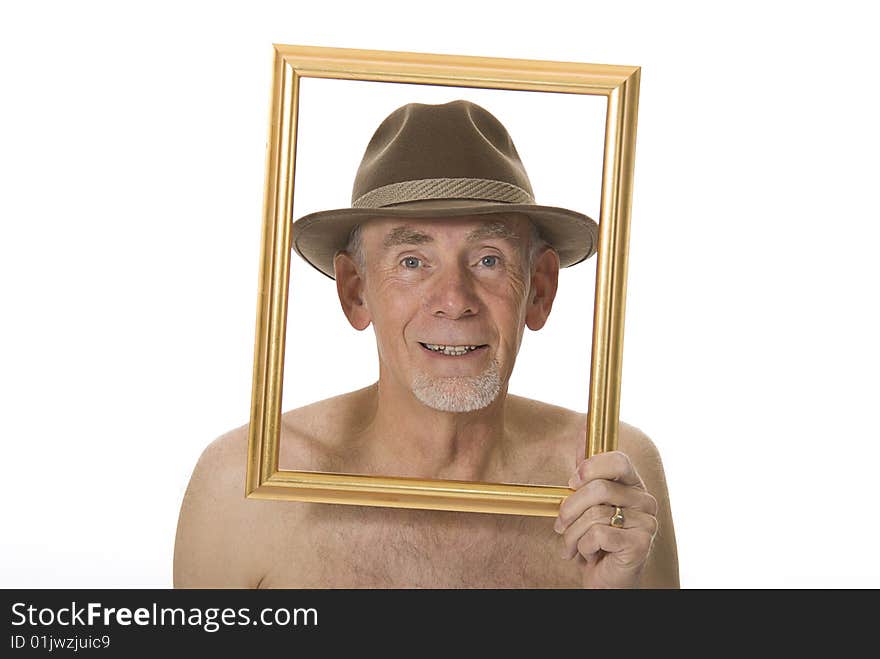 Unclothed senior man laughing through picture frame. Unclothed senior man laughing through picture frame