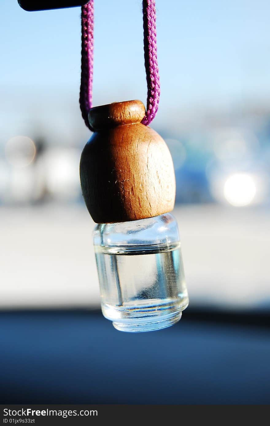 A modern car's ventilation system with an air freshener on it. Shallow DOF, focus on the tip of the freshener. A modern car's ventilation system with an air freshener on it. Shallow DOF, focus on the tip of the freshener.