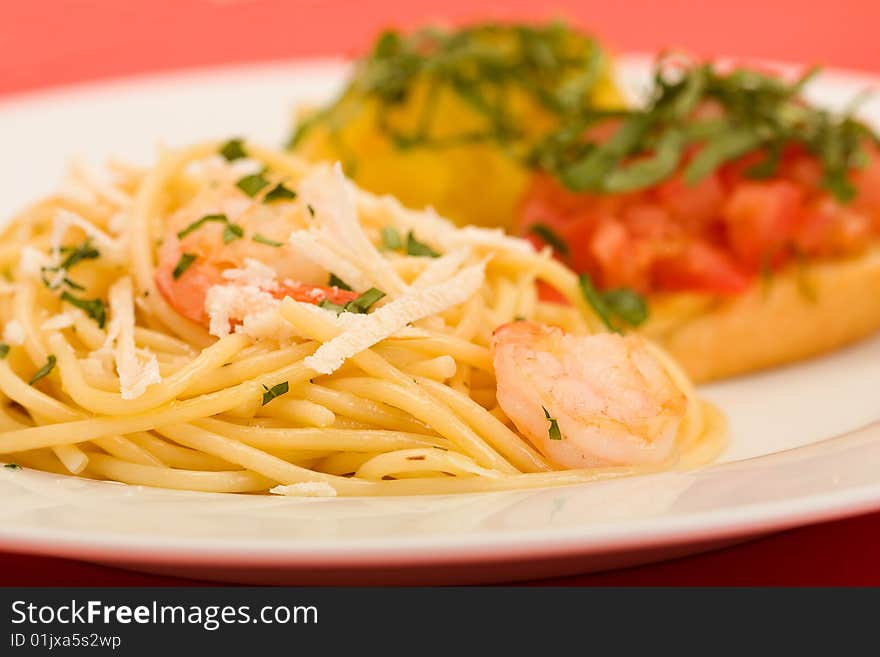 Shrimp pasta with garlic herb butter sauce and tomato and basil bruchetta. Shrimp pasta with garlic herb butter sauce and tomato and basil bruchetta