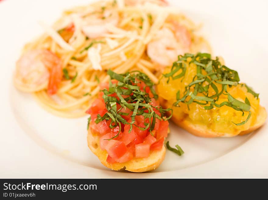 Shrimp pasta with garlic herb butter sauce and tomato and basil bruchetta. Shrimp pasta with garlic herb butter sauce and tomato and basil bruchetta