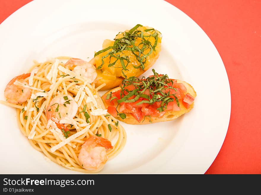 Shrimp pasta with garlic herb butter sauce and tomato and basil bruchetta. Shrimp pasta with garlic herb butter sauce and tomato and basil bruchetta