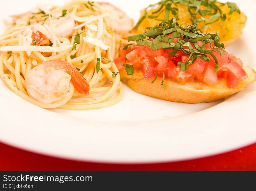 Shrimp pasta with garlic herb butter sauce and tomato and basil bruchetta. Shrimp pasta with garlic herb butter sauce and tomato and basil bruchetta