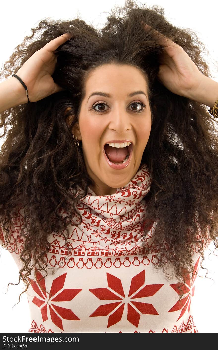 Beautiful woman shouting and holding her hairs on an isolated white background