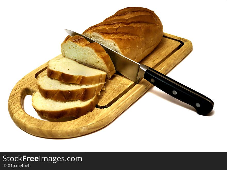 Long loaf sliced by kitchen-knife