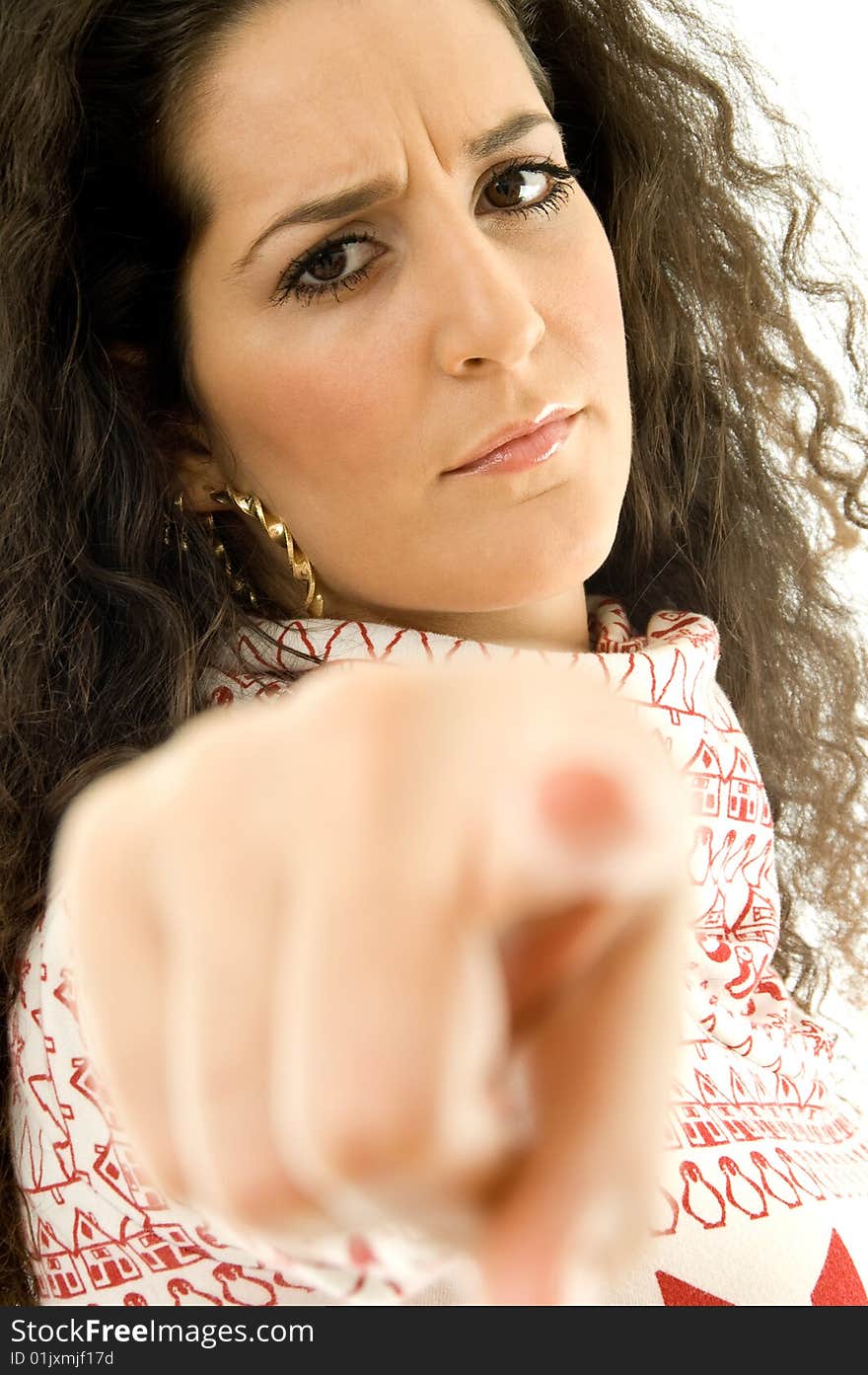 Beautiful angy woman pointing towards on an isolated white background. Beautiful angy woman pointing towards on an isolated white background