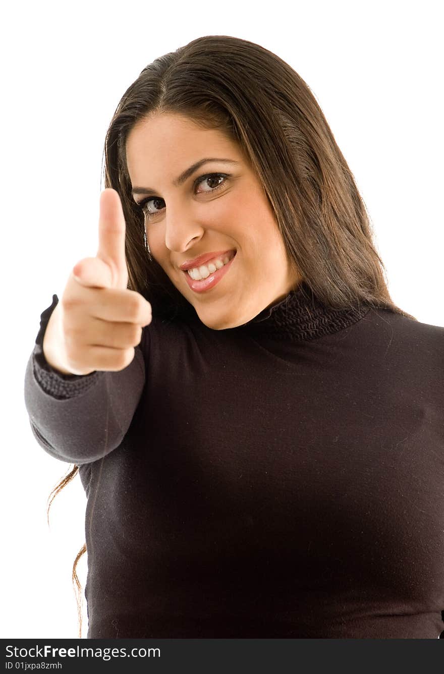 Fashionable woman happy and pointing towards camera on an isolated background