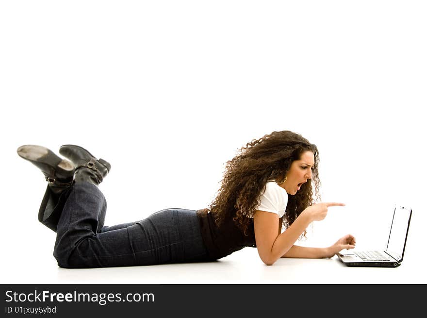 Woman lying on the floor and working on laptop