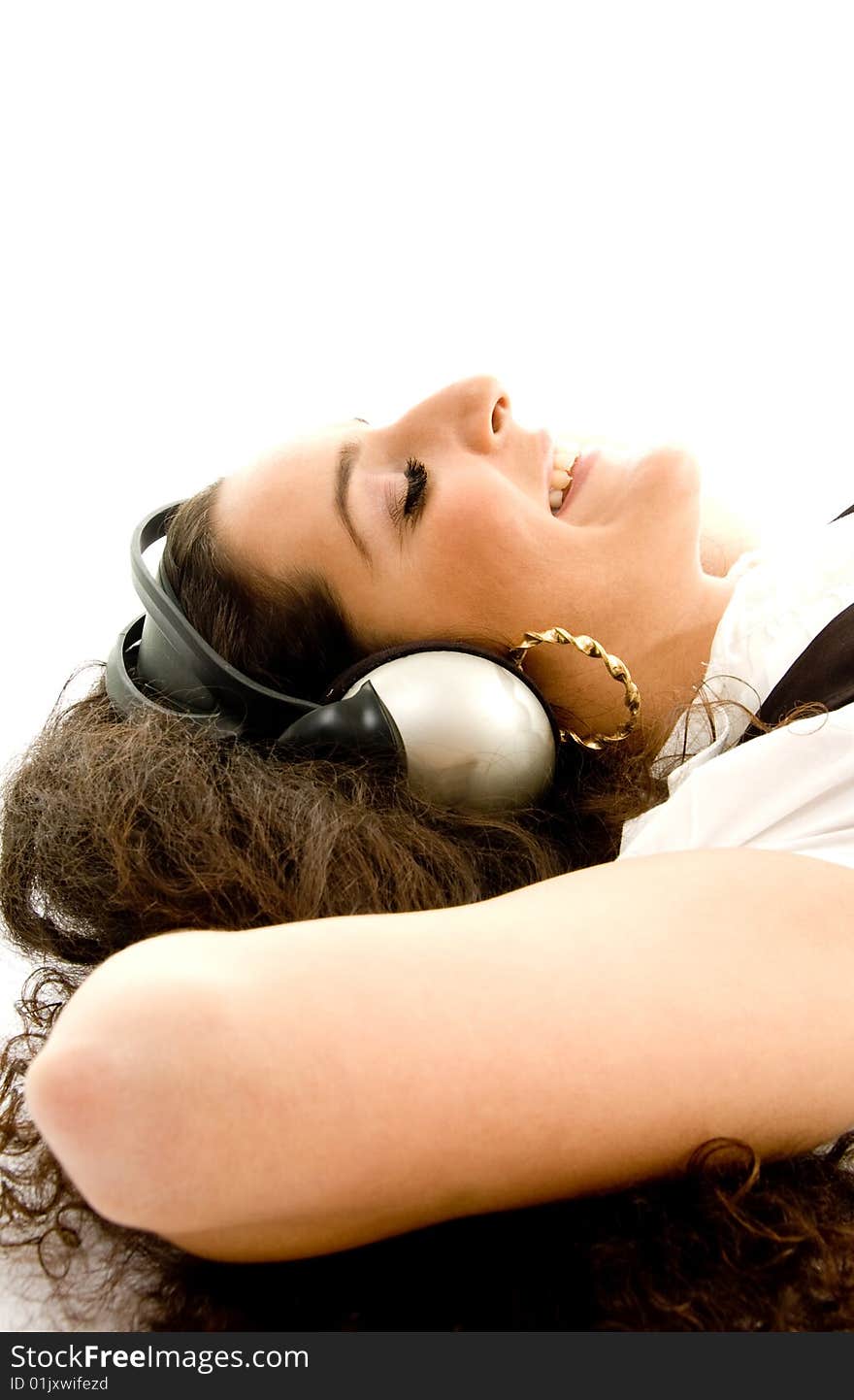 Pretty woman wearing headphones with white background