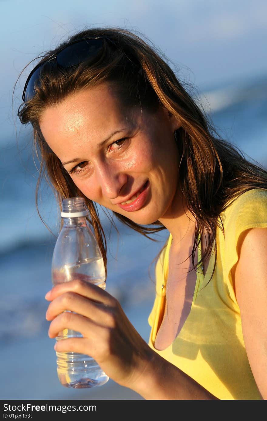 Woman holding a bottle water in her hand. Woman holding a bottle water in her hand