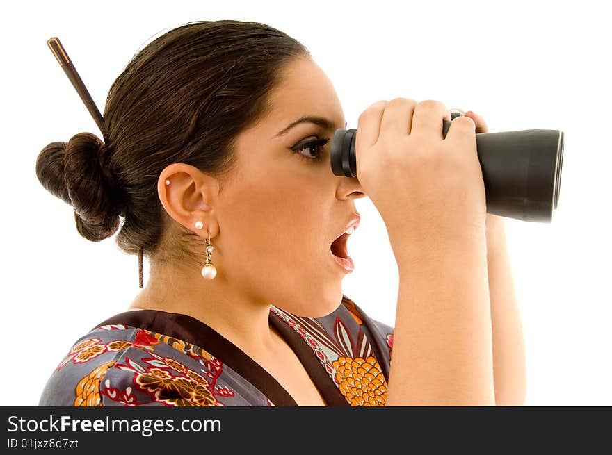 Beautiful woman looking through binoculars