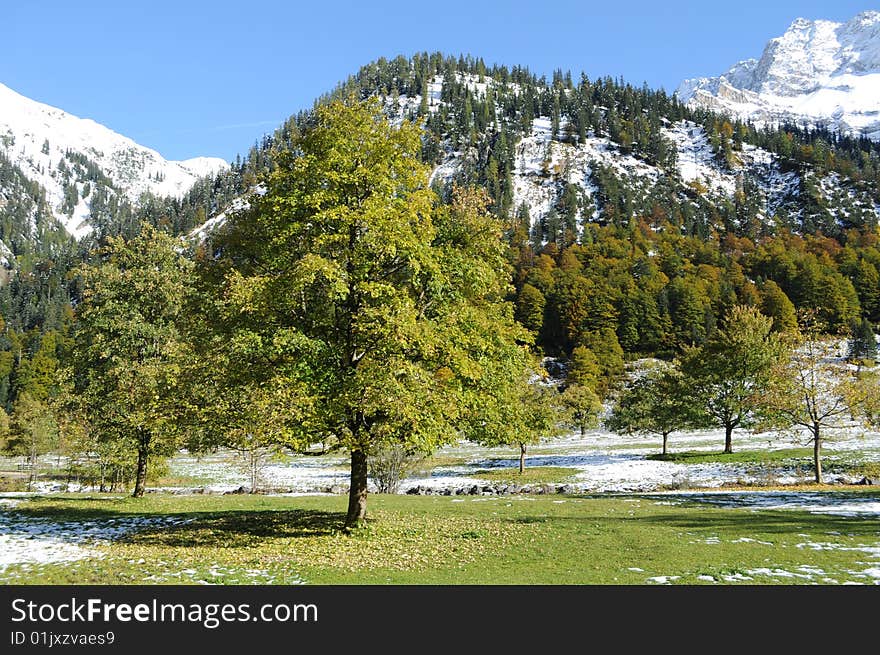 A view in the mountains with snow. A view in the mountains with snow.