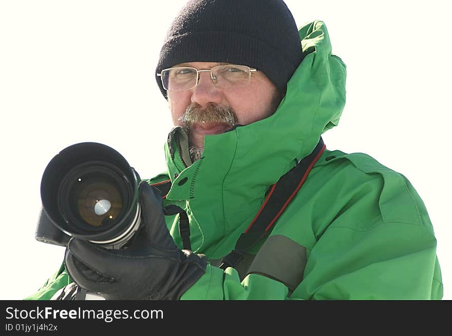 Photographer holding camera with big lens