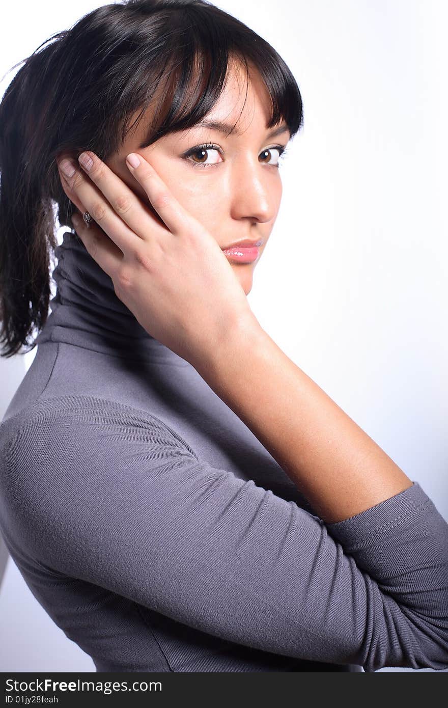 Portrait of beautiful woman with hand touching her head