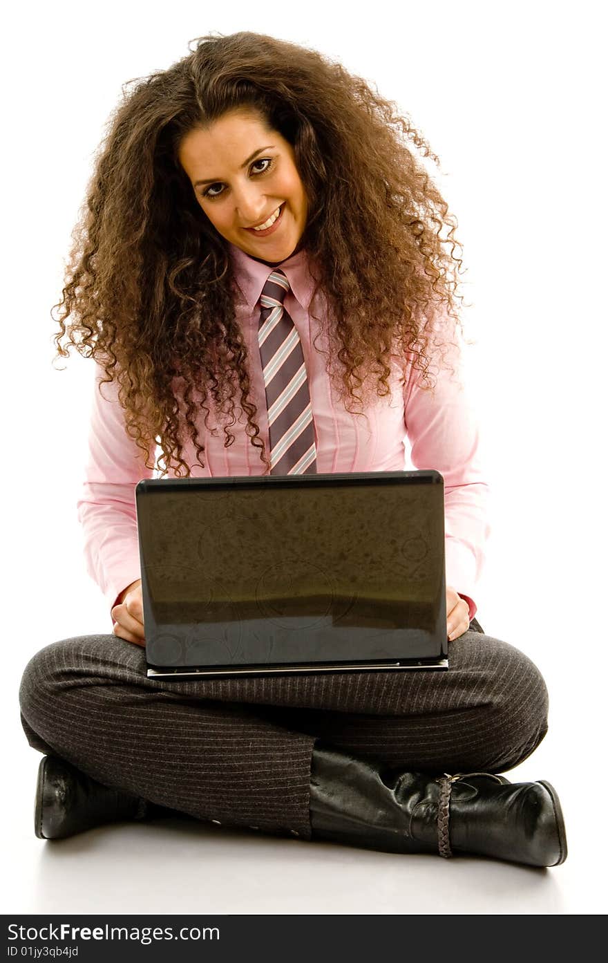 Young hispanic female busy working on laptop on an isolated background