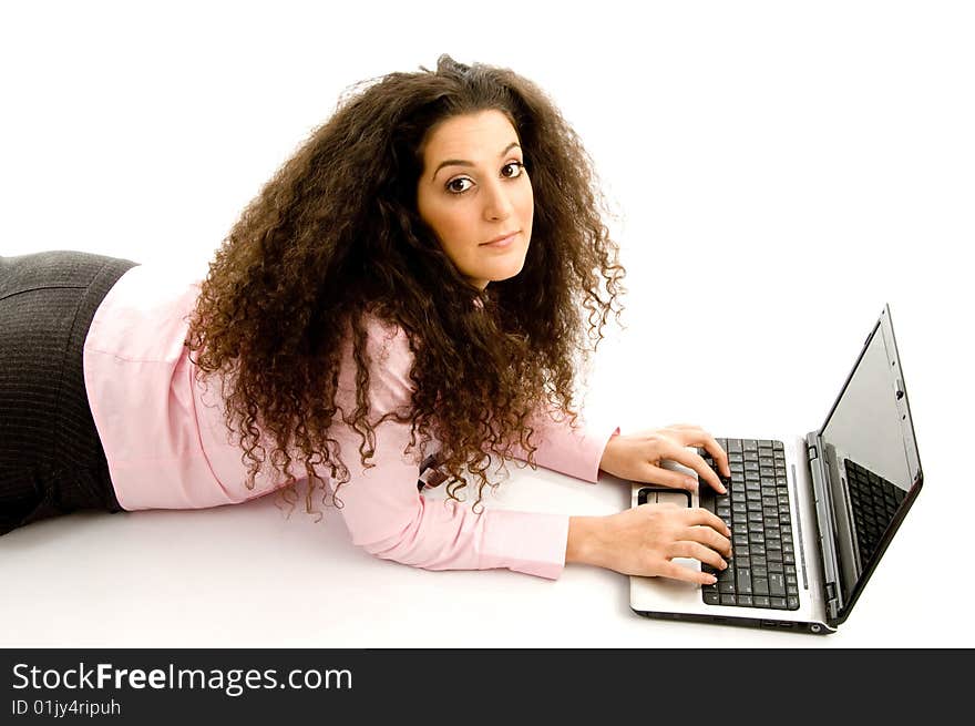 Attractive young executive busy with laptop on an isolated white background