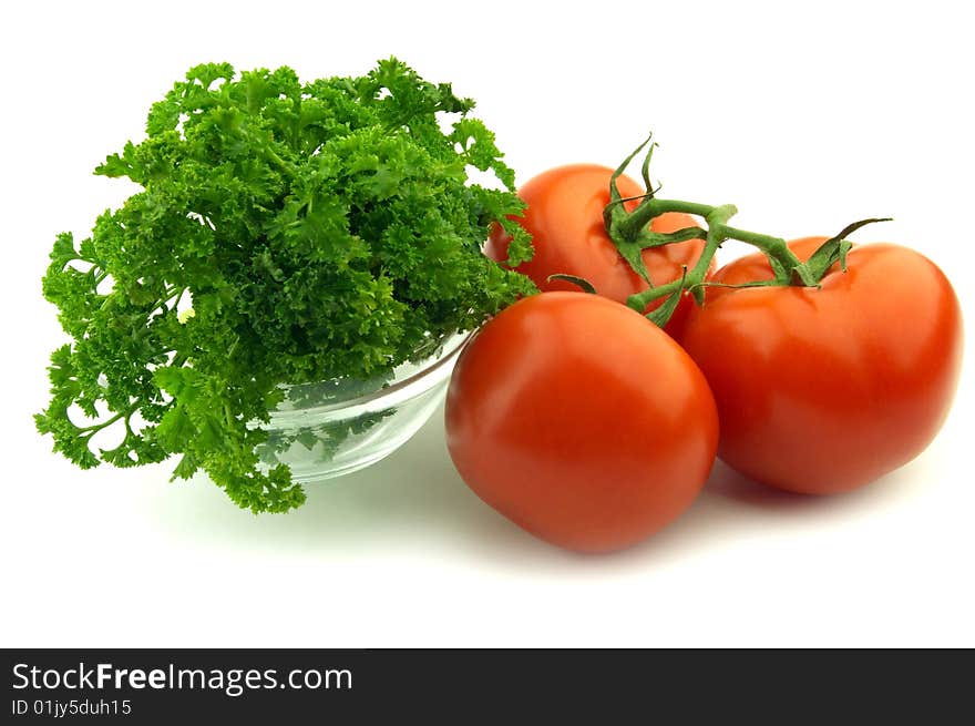 Parsley and tomate on a white background