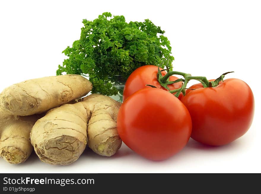 Ginger with tomate on a white background