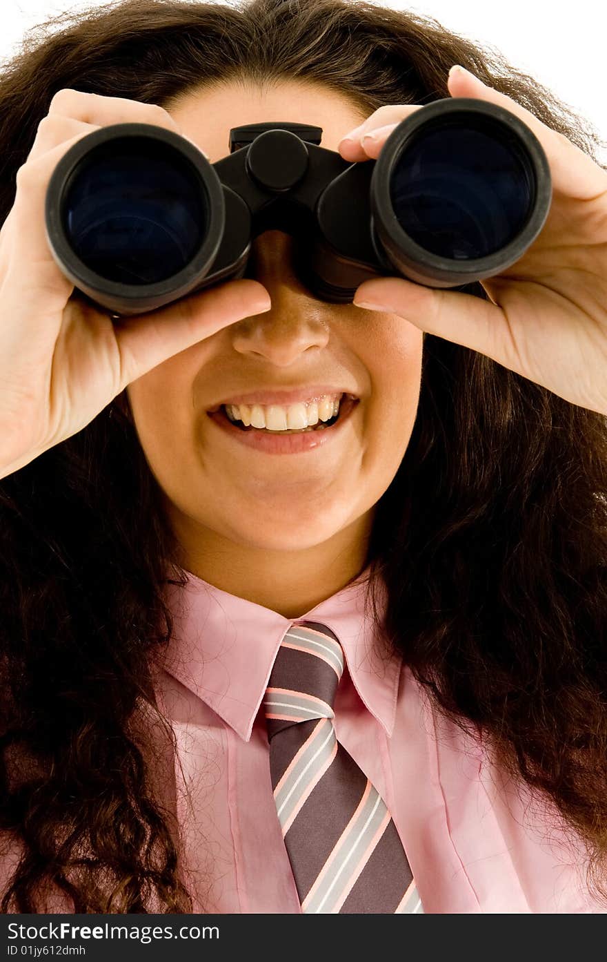 Beautiful young businesswoman using a pair of binoculars with white background