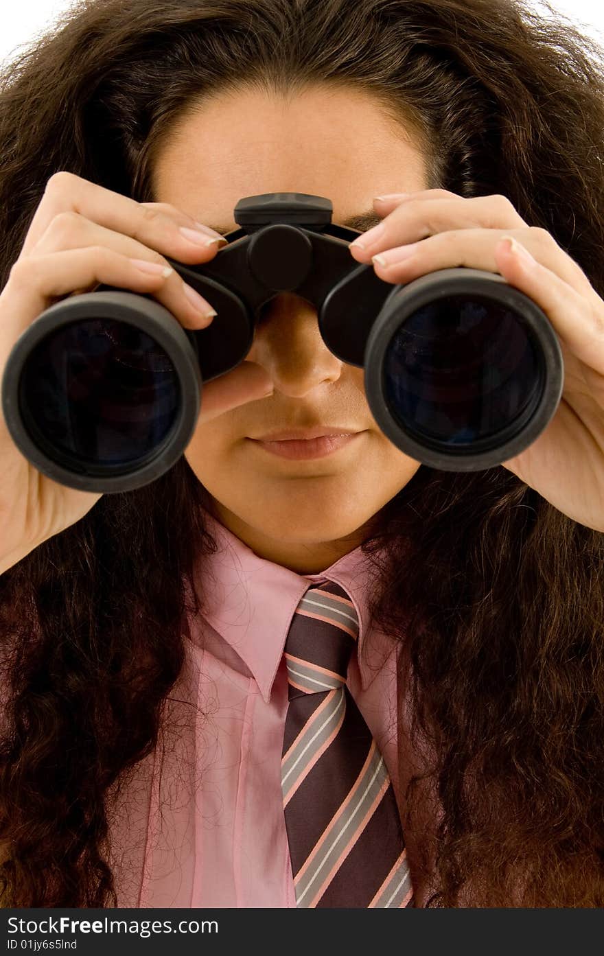 Young corporate woman viewing through binoculars against white background