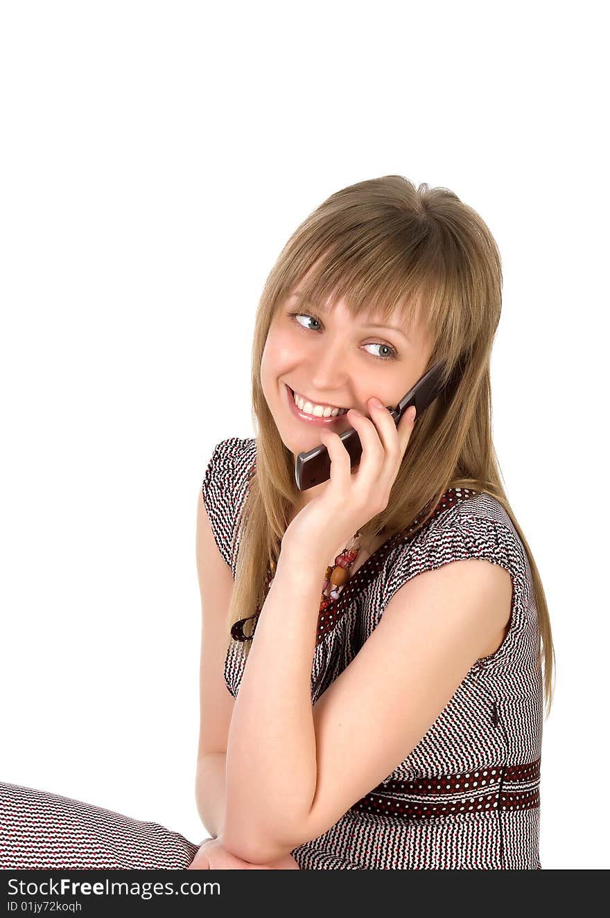 Woman listens on a mobile phone