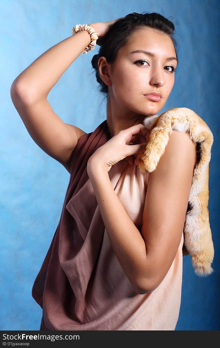 Elegant woman touching head with handsю Fashion photo