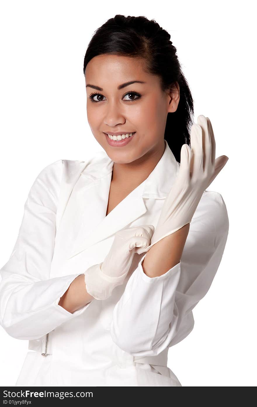 Beautifull Indonesian nurse putting gloves on